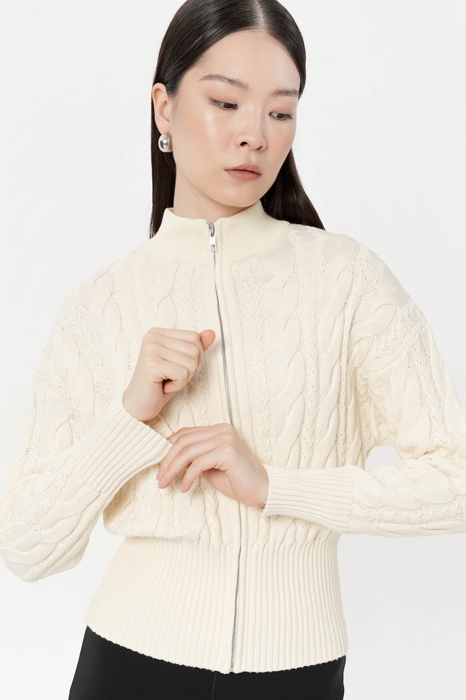 Oryx Cable Knit Cardigan In Creme